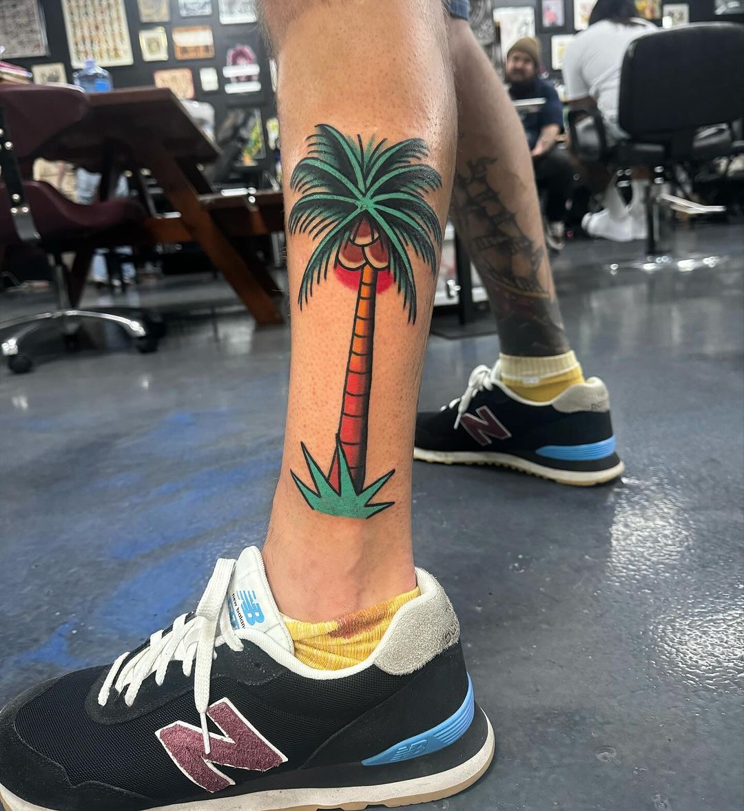 sixer-tattoo-illustrative-palm-tree-on-calf
